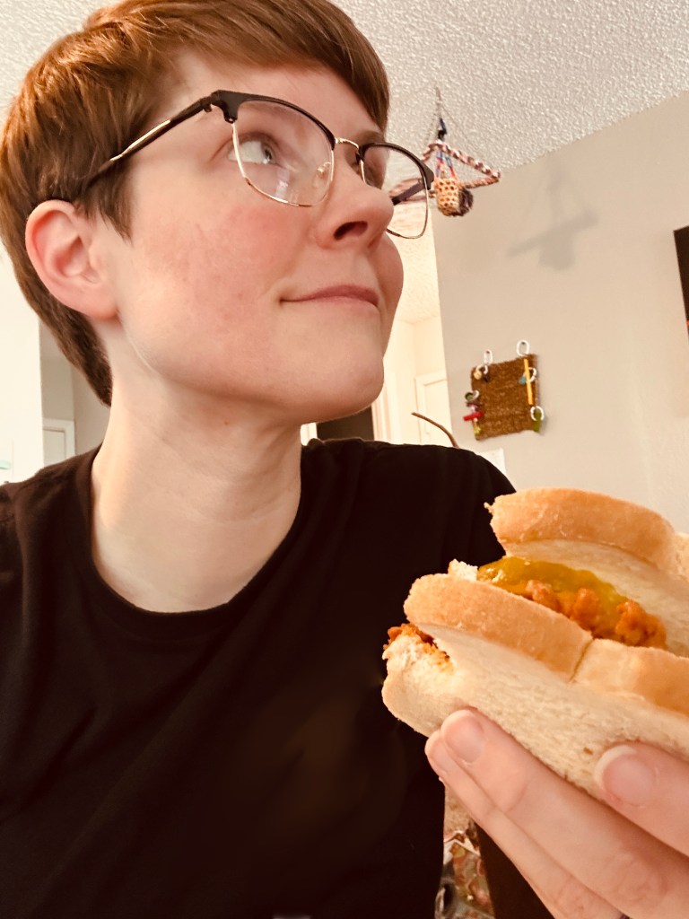 Photo of holding a sandwich.